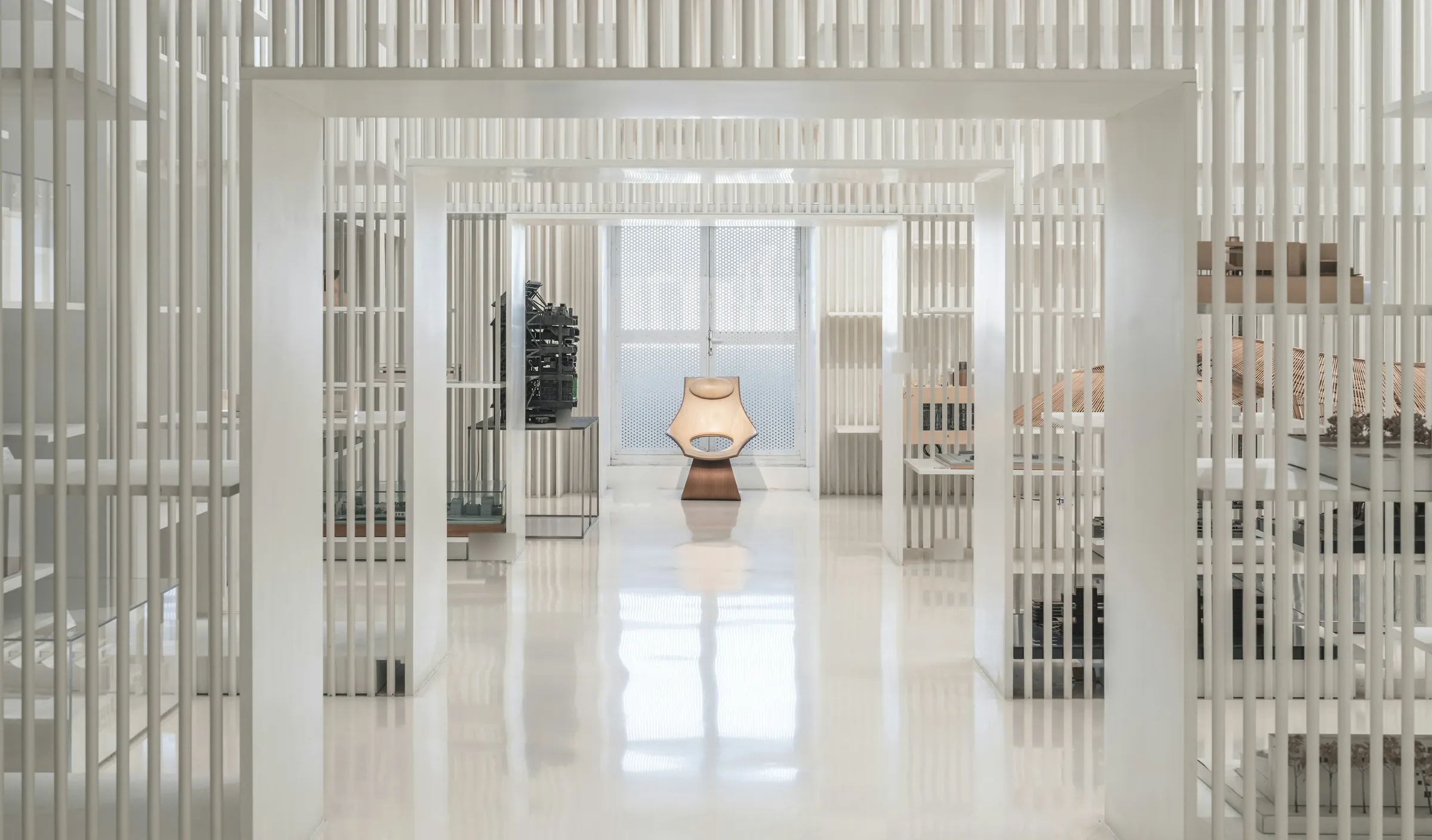 Illustrative photograph: an empty, all-white design showroom